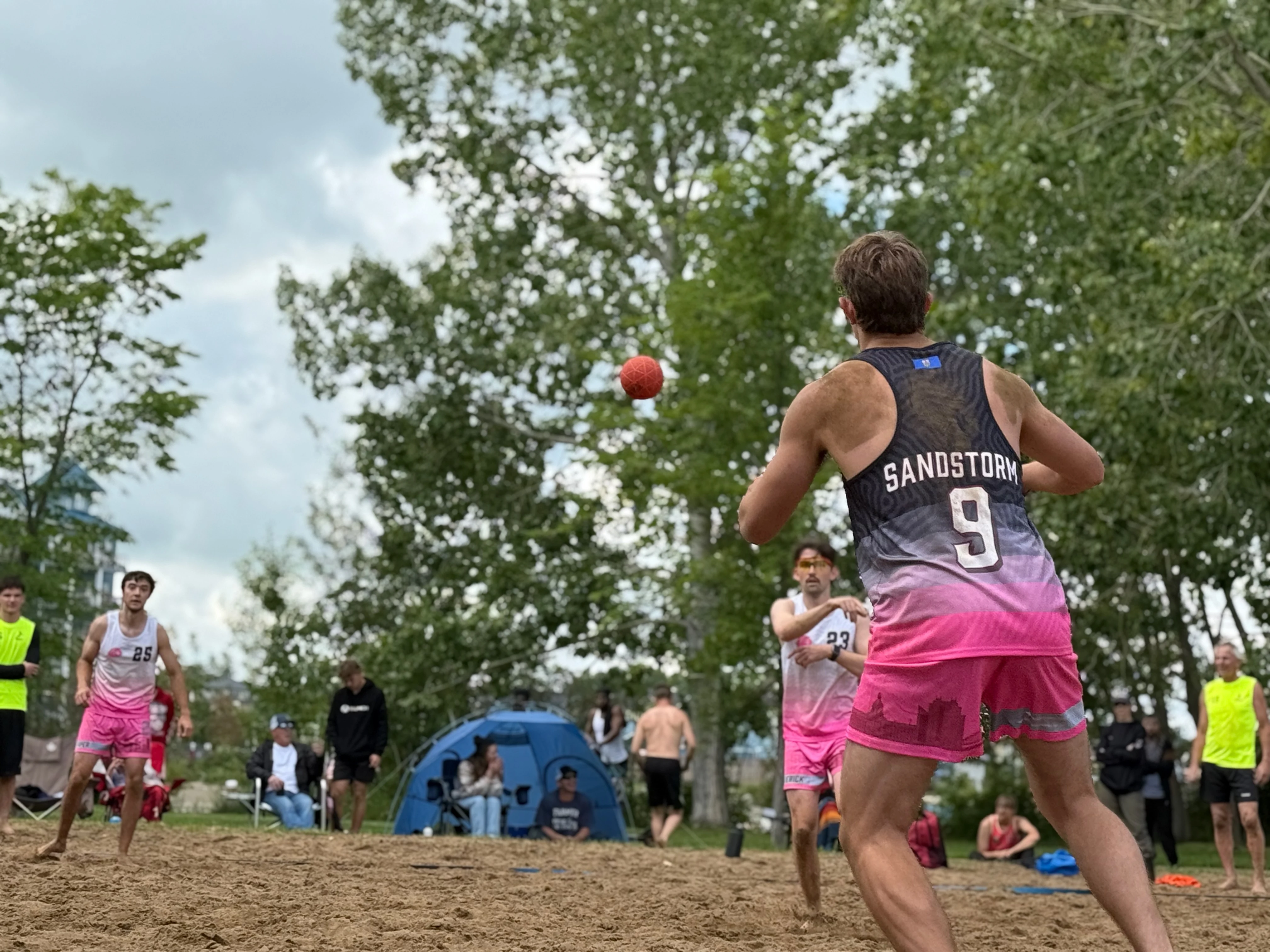 Sherwood Park Sandstorm player #9 in custom pink and black PTW singlet, beach handball